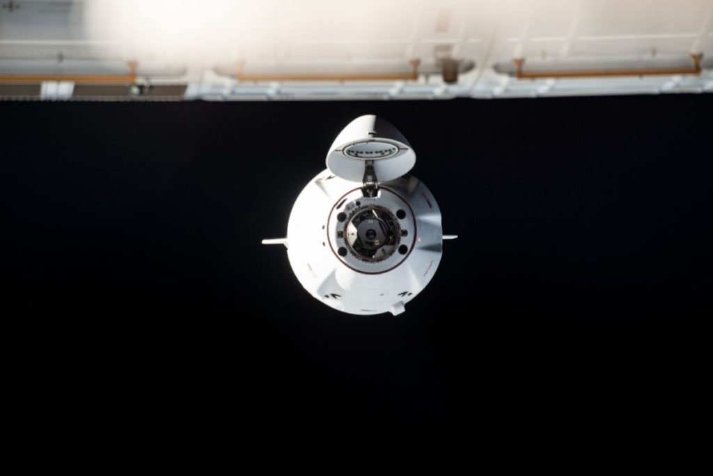 A SpaceX Dragon cargo capsule approaches the International Space Station on July 16, 2022, on the company