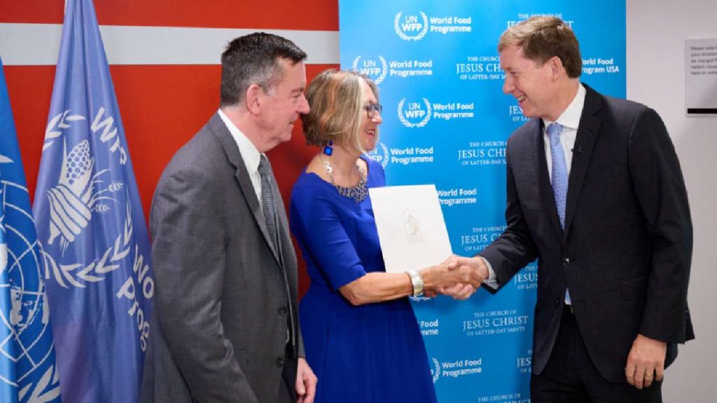 Bishop L. Todd Budge, right, of the Presiding Bishopric presented a $32 million donation to World Food Programme USA President and CEO Barron Segar, left, and WFP Deputy Executive Director Ute Klamert, center, on Wednesday at the World Food Programme headquarters in Rome.